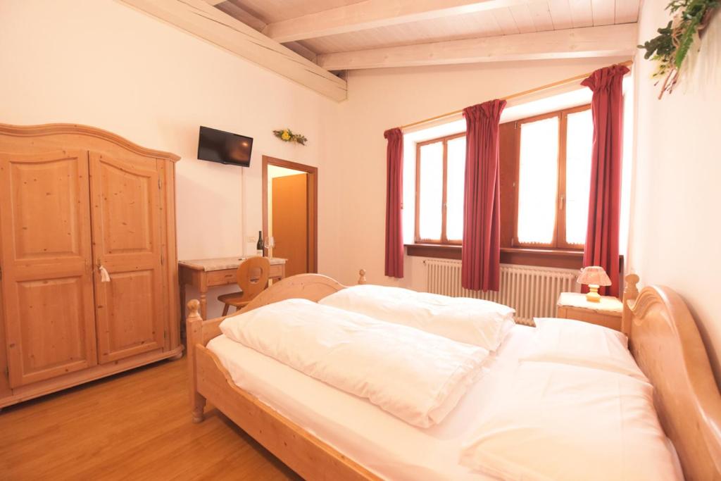 Postel nebo postele na pokoji v ubytování Agriturismo Salizzoni