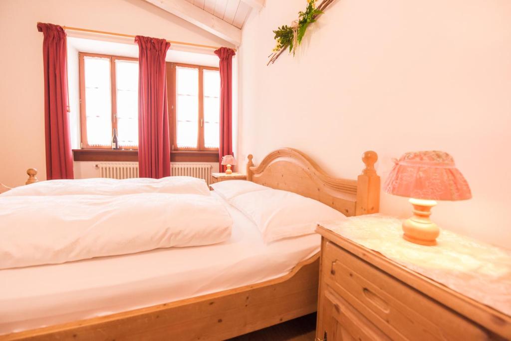 Postel nebo postele na pokoji v ubytování Agriturismo Salizzoni