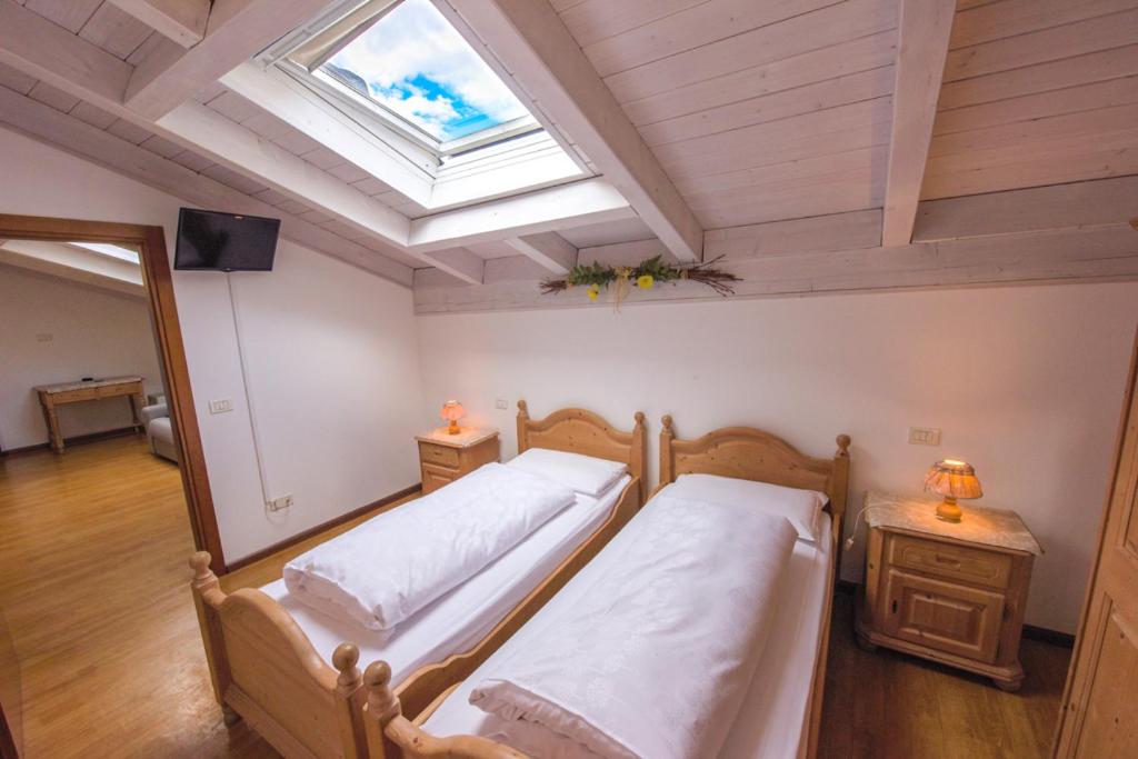 Postel nebo postele na pokoji v ubytování Agriturismo Salizzoni