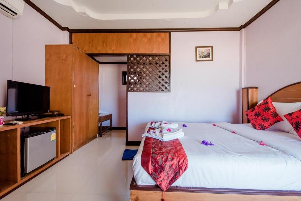 Postel nebo postele na pokoji v ubytování Baan Rabieng Resort