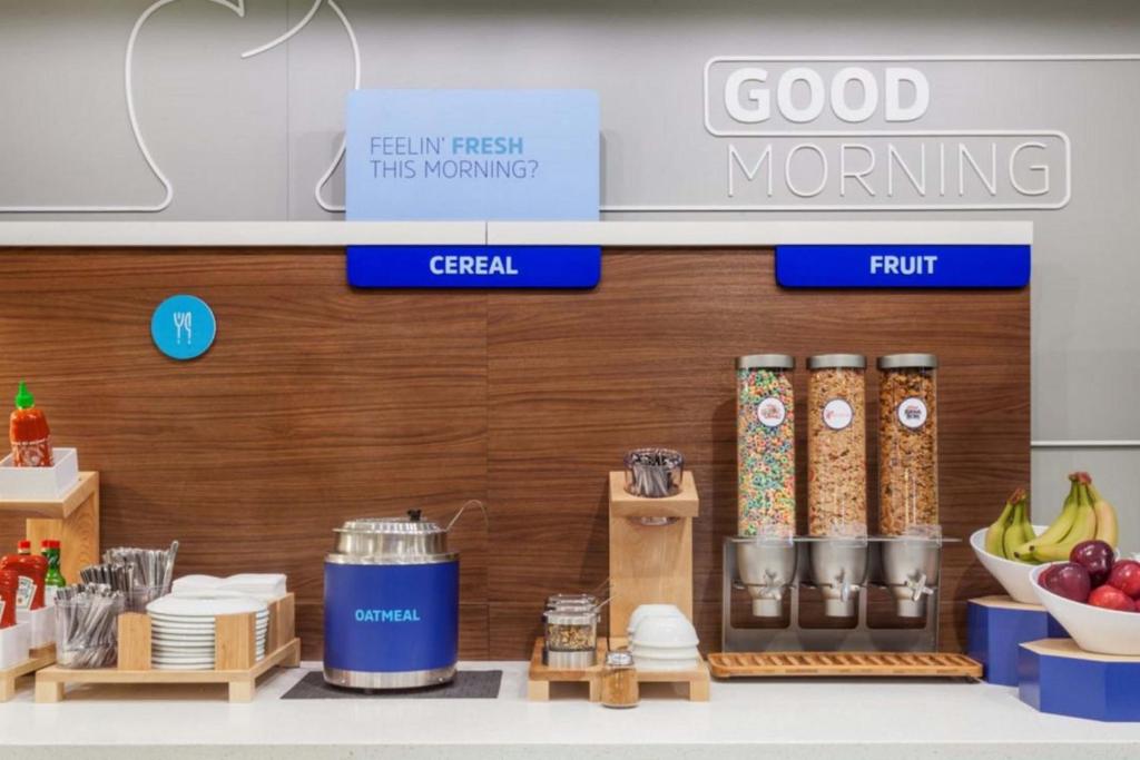a grocery store with food items on a counter at Holiday Inn Express & Suites - Green Bay East by IHG in Green Bay