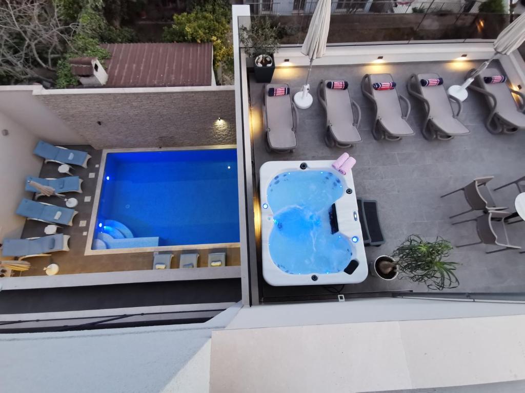 an overhead view of a swimming pool on a house at Luxury Rooms Pino in Split