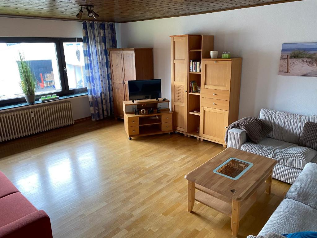 a living room with a couch and a table at Apartment Gohfeld in Löhne