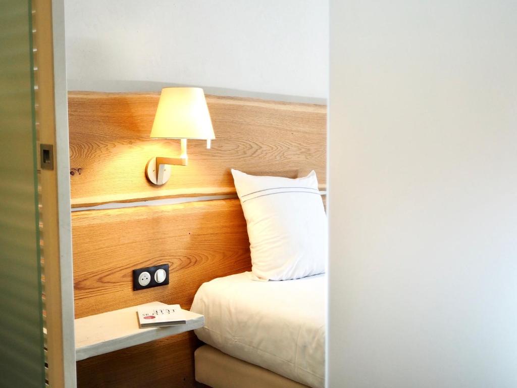 Postel nebo postele na pokoji v ubytování Maison Jenny Hotel Restaurant & Spa