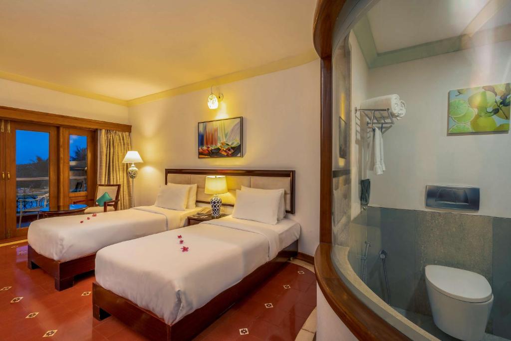 Postel nebo postele na pokoji v ubytování Radisson Blu Resort, Goa