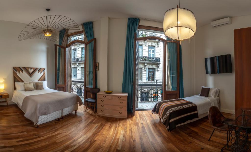 Ένα ή περισσότερα κρεβάτια σε δωμάτιο στο L'Adresse Hôtel Boutique
