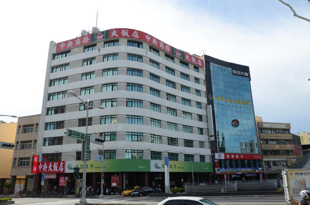 a large building with a sign on top of it at Centre Hotel in Kaohsiung