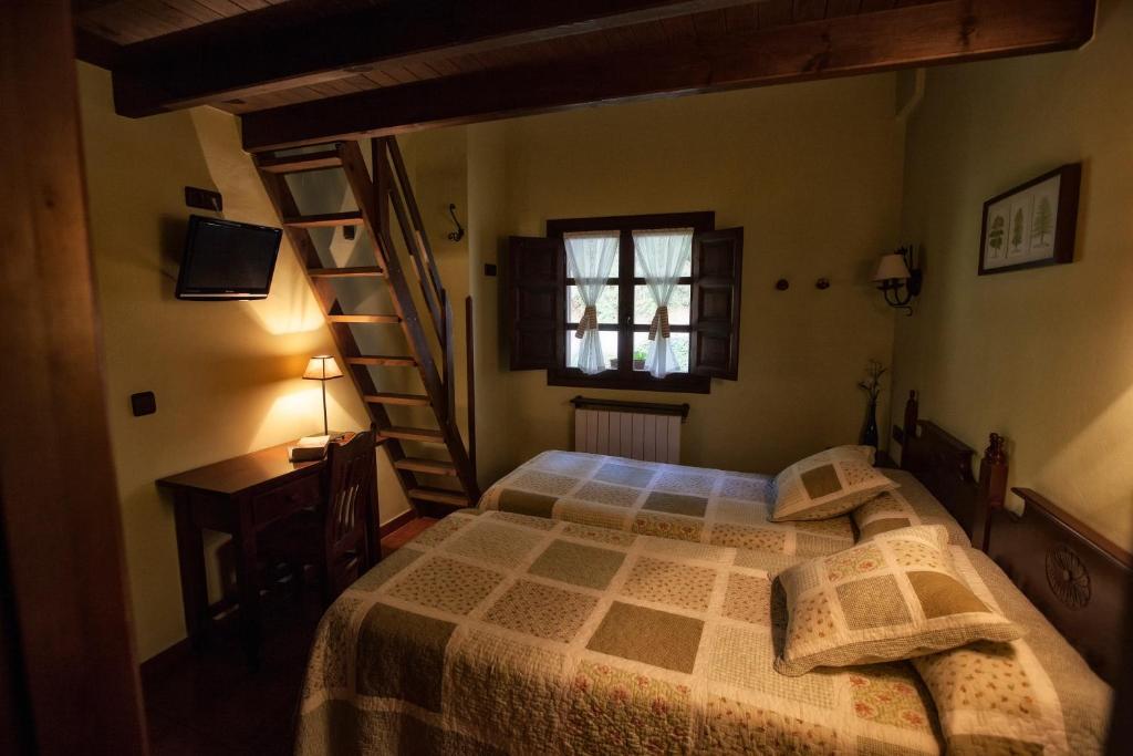 Postel nebo postele na pokoji v ubytování Casa Asprón
