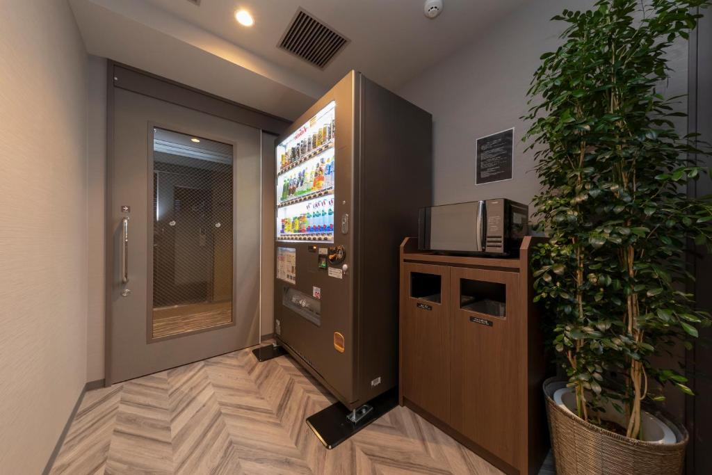 TV a/nebo společenská místnost v ubytování Dormy Inn Premium Fukui Natural Hot Spring