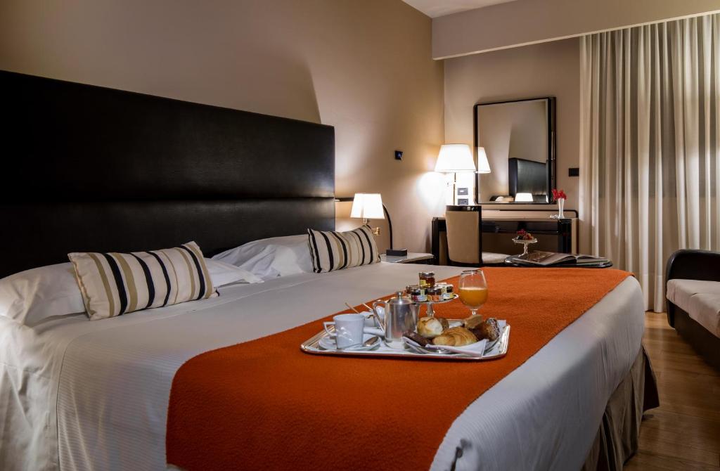 Postel nebo postele na pokoji v ubytování Park Hotel Ai Cappuccini