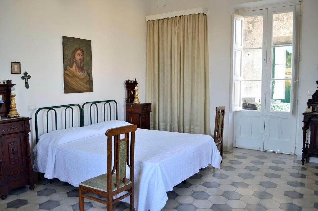 Postel nebo postele na pokoji v ubytování Residenza Storica PARCO LANOCE