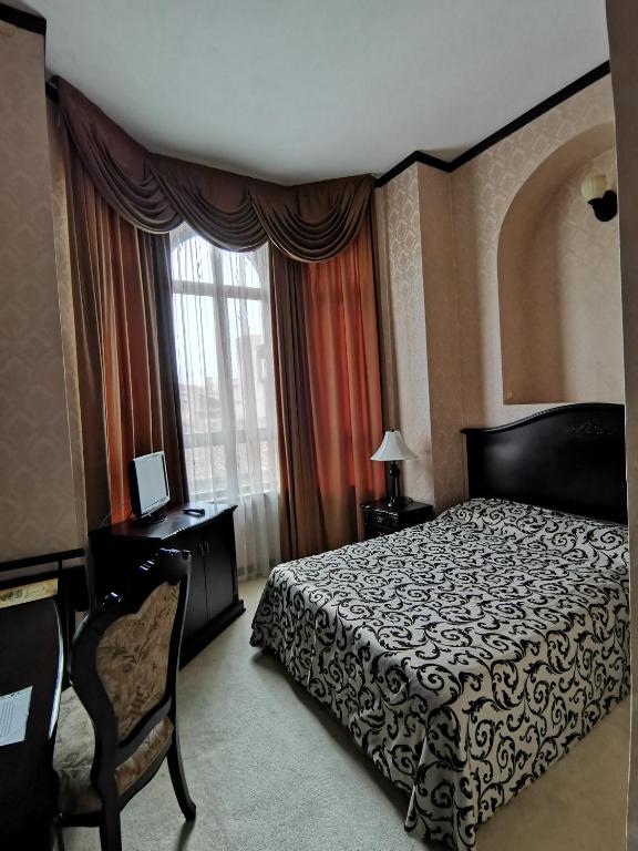 Кровать или кровати в номере Hotel Carol