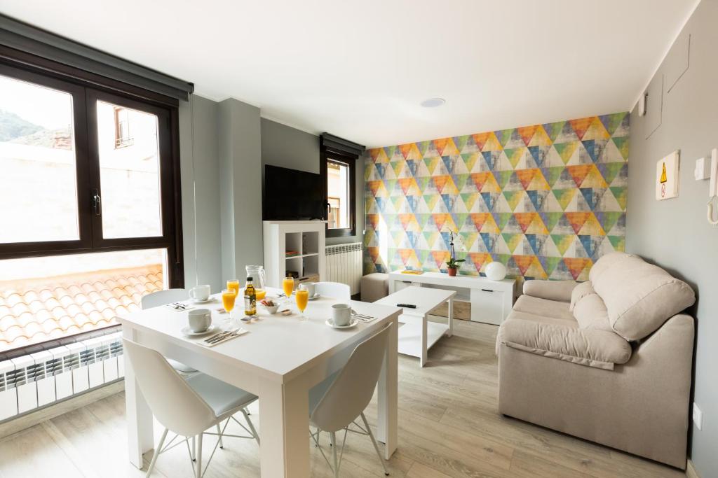 a living room with a white table and a couch at Apartamentos Turísticos San Lorenzo in Nájera