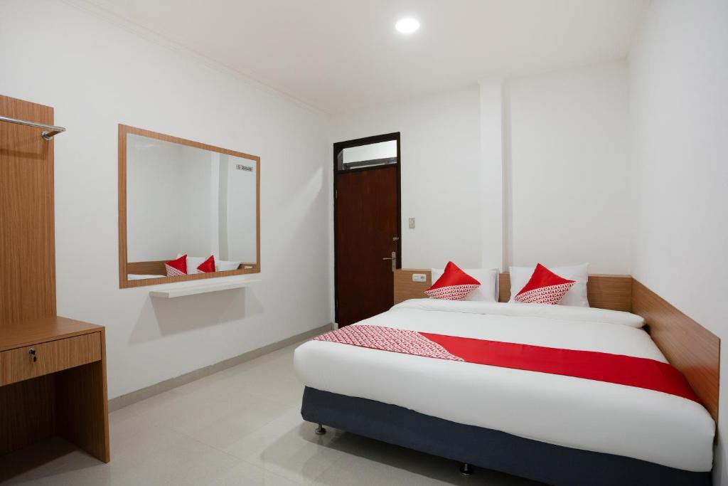 Ένα ή περισσότερα κρεβάτια σε δωμάτιο στο Hotel O Hegarbudhi Residence