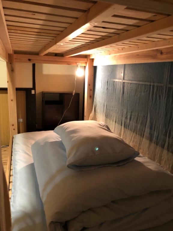 Postel nebo postele na pokoji v ubytování おとまち 甘藍 Otomachi Kanran