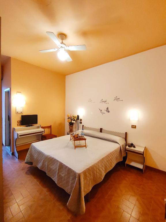 Postel nebo postele na pokoji v ubytování Hotel Palazzi