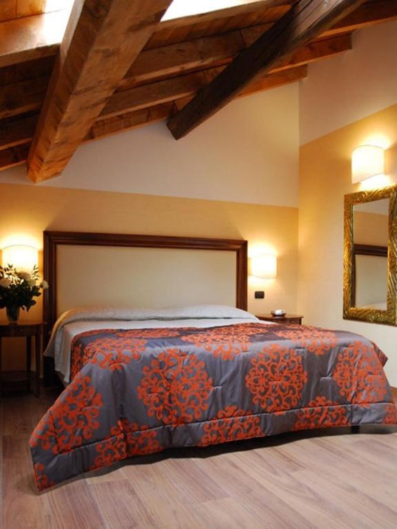 Postel nebo postele na pokoji v ubytování Hotel Cascina Marisa