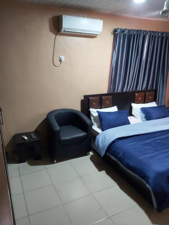 Postel nebo postele na pokoji v ubytování StayCation Suites And Apartment