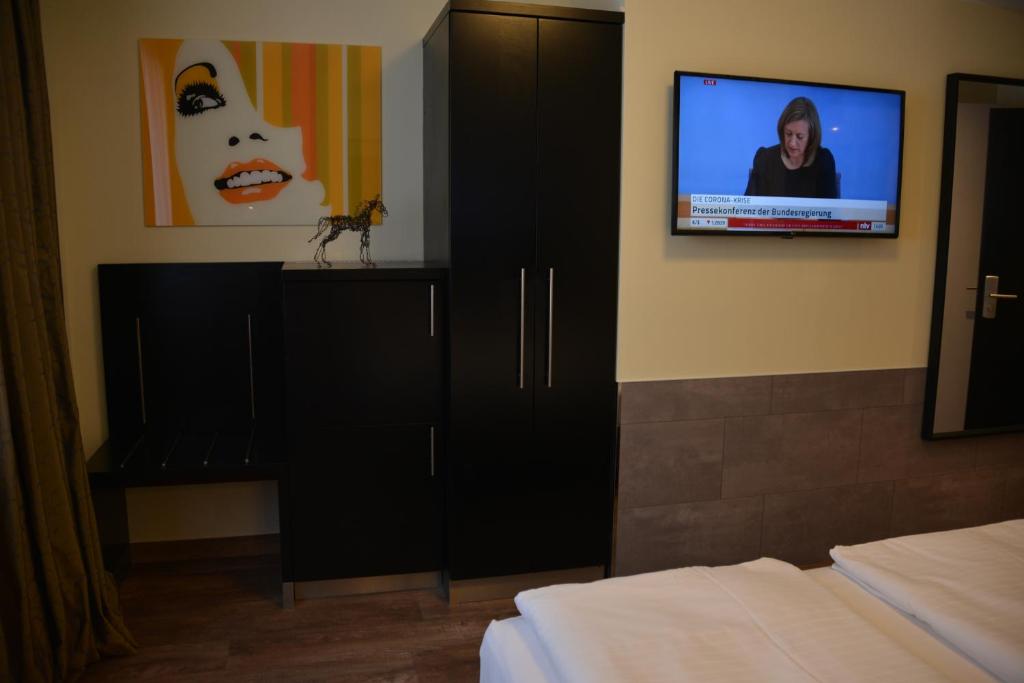 TV a/nebo společenská místnost v ubytování Belle Blue Zentrum