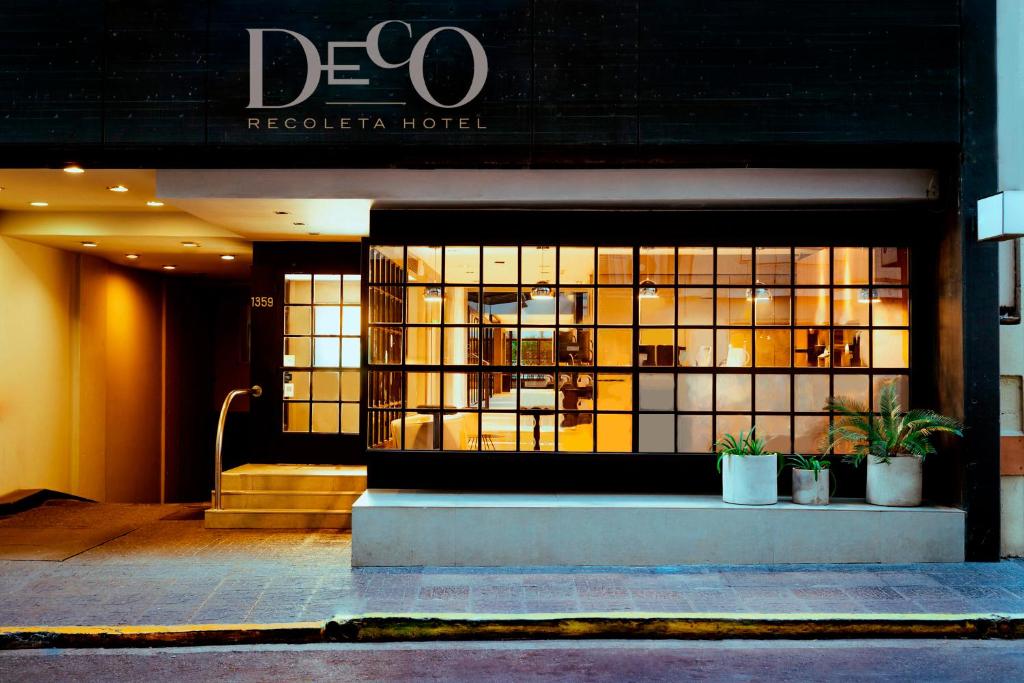a store front of a reederha hotel with windows at Deco Collection in Buenos Aires