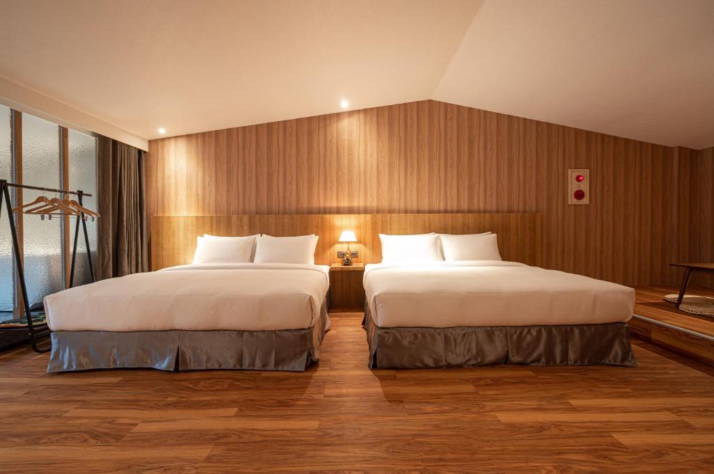 Postel nebo postele na pokoji v ubytování Yunoyado Onsen Hot Spring Hotel Deyang