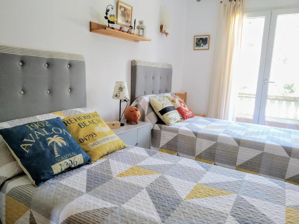 Postel nebo postele na pokoji v ubytování Villa Cala Pi Family