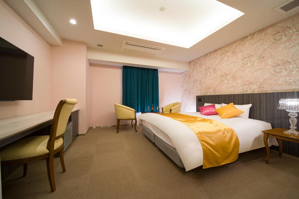 Postel nebo postele na pokoji v ubytování HOTEL LASCALA