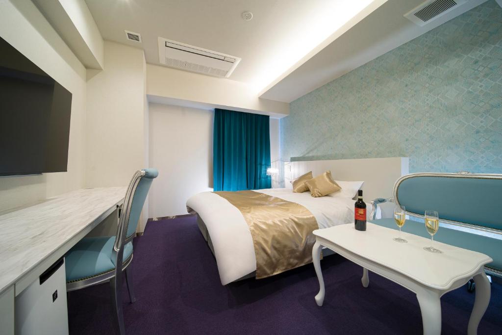 Postel nebo postele na pokoji v ubytování HOTEL LASCALA