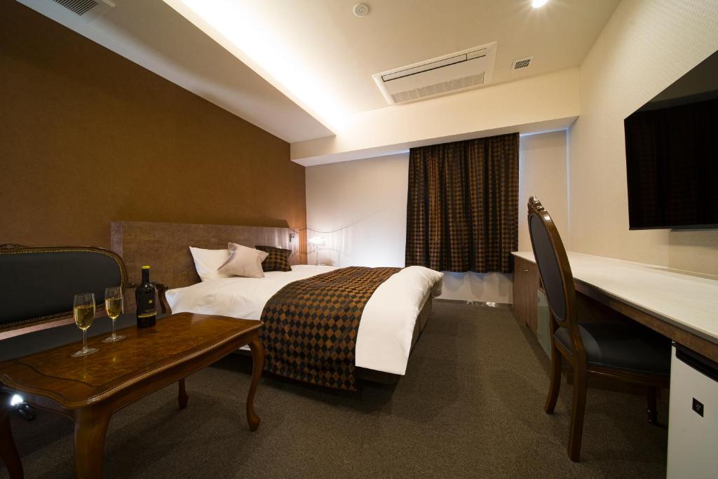 Postel nebo postele na pokoji v ubytování HOTEL LASCALA