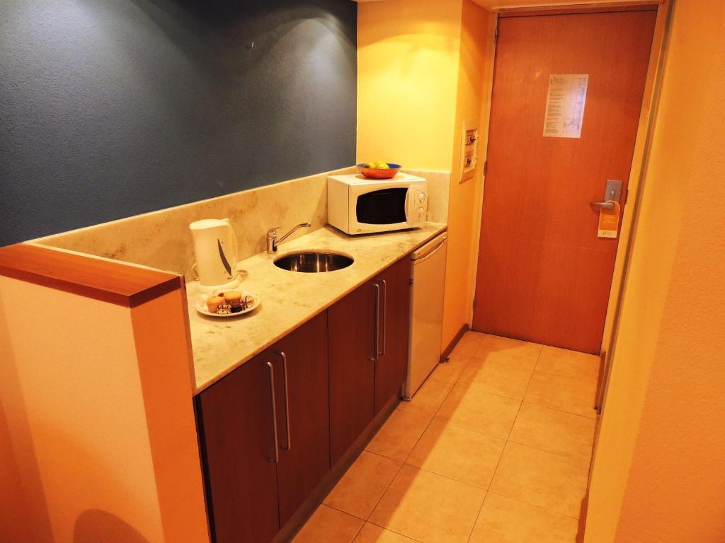 Kuchyň nebo kuchyňský kout v ubytování King David Flat Hotel - Argentina