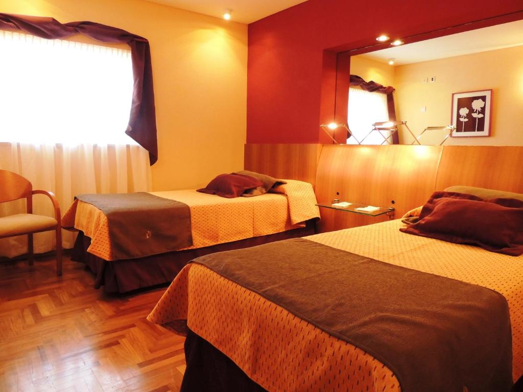 Postel nebo postele na pokoji v ubytování King David Flat Hotel - Argentina
