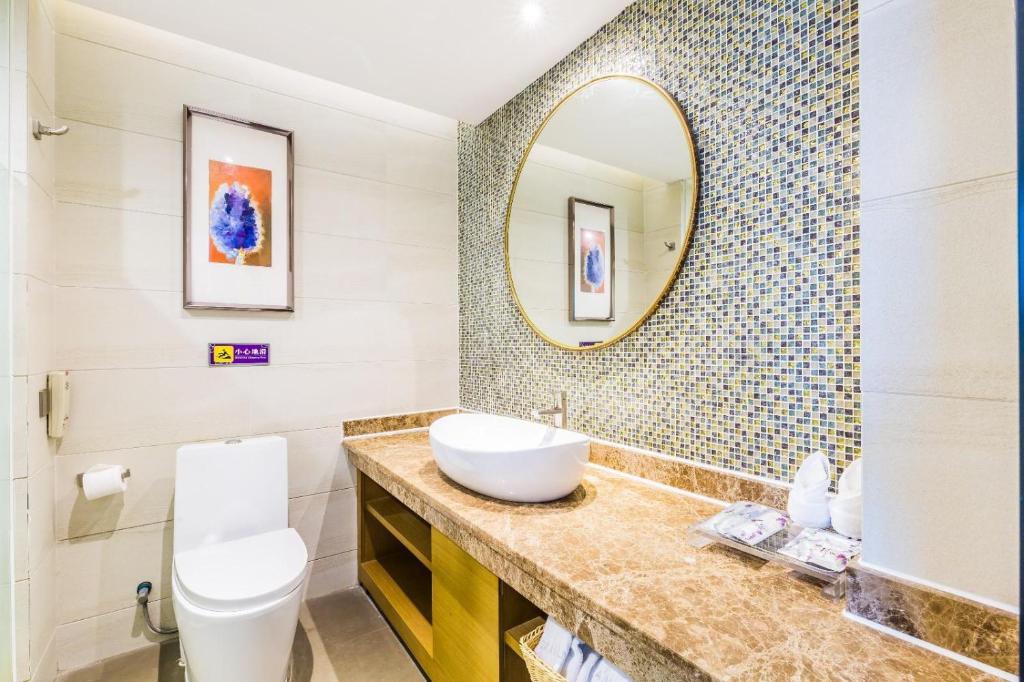 a bathroom with a sink and a mirror at Lavande Hotel Foshan Shunde Ronggui in Shunde