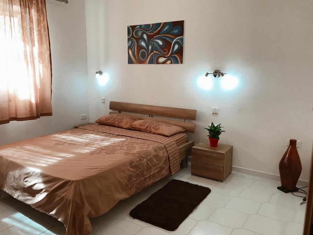 Postel nebo postele na pokoji v ubytování Villa Naxxar Malta
