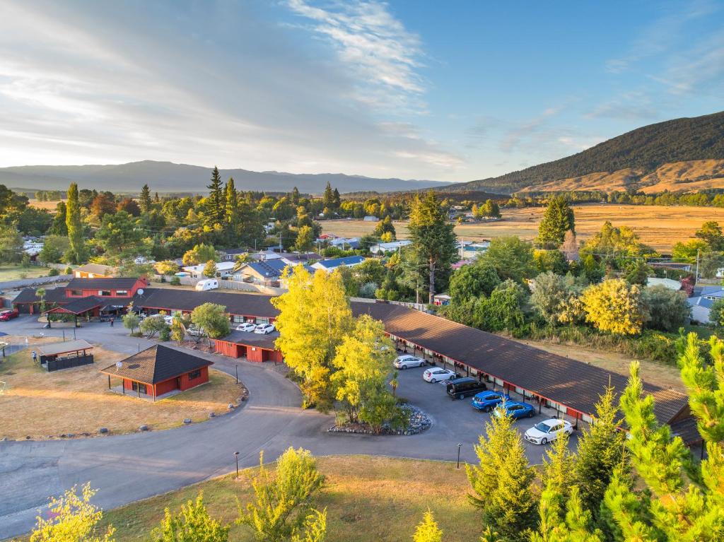 an aerial view of a parking lot in a town at Parklands Motorlodge & Holiday Park in Turangi