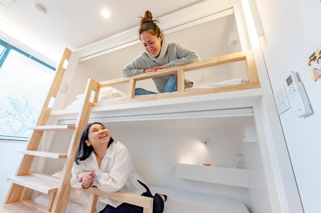 Postel nebo postele na pokoji v ubytování plat hostel keikyu haneda home