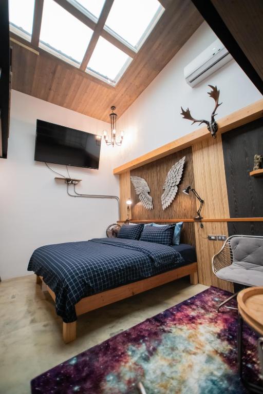 Postel nebo postele na pokoji v ubytování QBE B&B