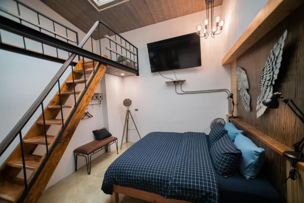 Postel nebo postele na pokoji v ubytování QBE B&B