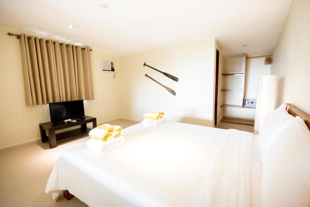 Postel nebo postele na pokoji v ubytování Boracay Amor Apartment