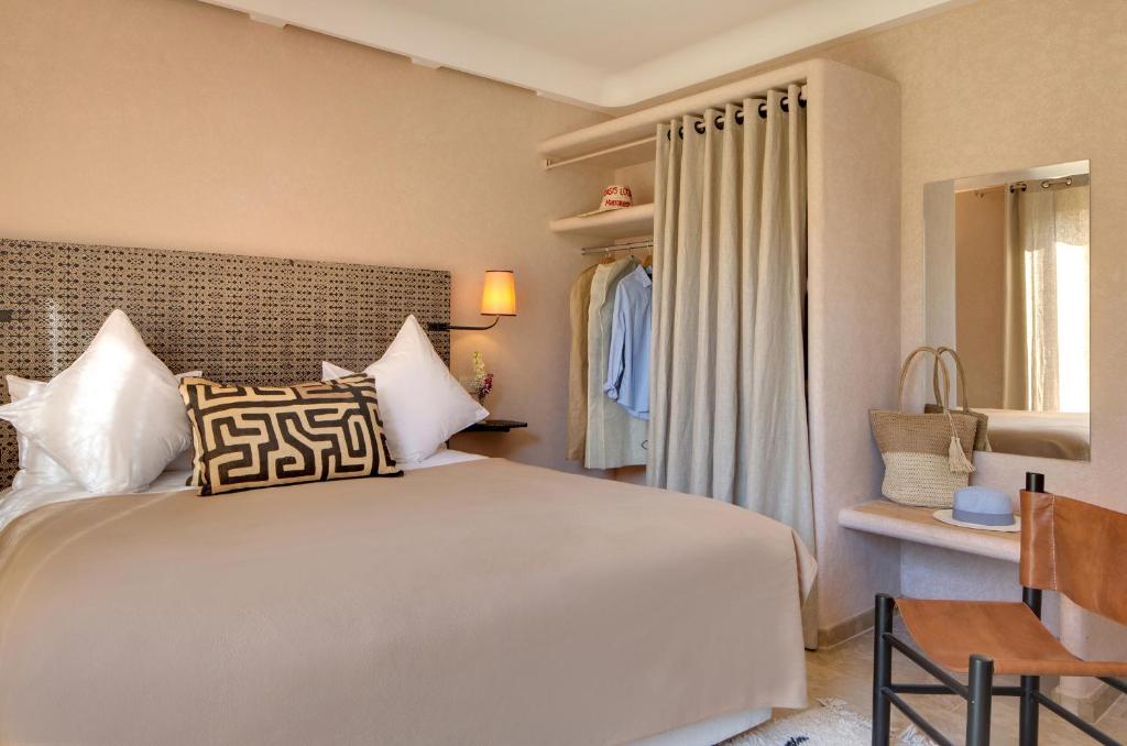Postel nebo postele na pokoji v ubytování Oasis lodges