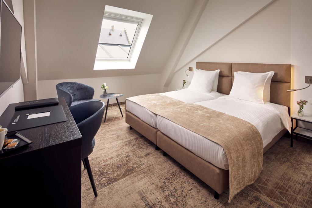 Postel nebo postele na pokoji v ubytování Van der Valk Hotel Mechelen