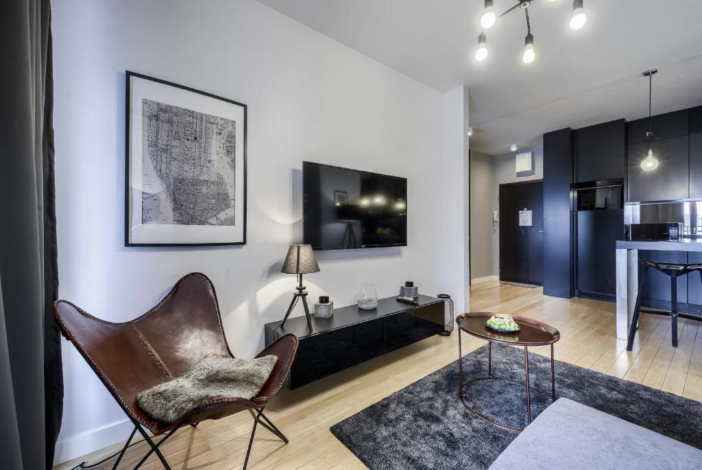 Televízia a/alebo spoločenská miestnosť v ubytovaní KaZou Residence