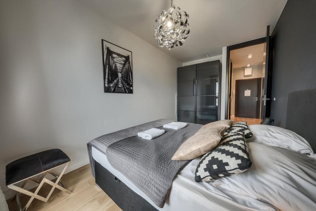 Posteľ alebo postele v izbe v ubytovaní KaZou Residence