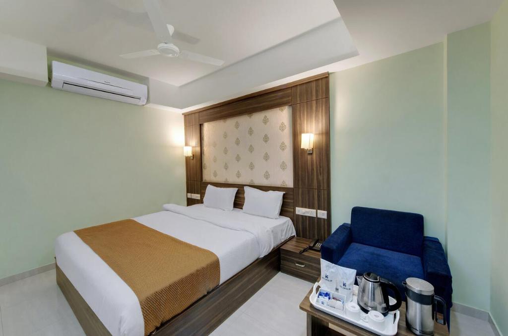 Postel nebo postele na pokoji v ubytování HOTEL SHITAL INN