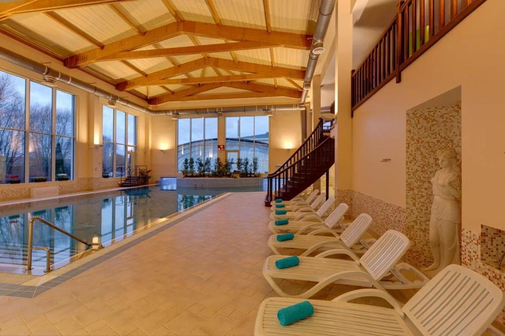 a row of chairs in a swimming pool at Grand Peterhof Spa Hotel in Petergof