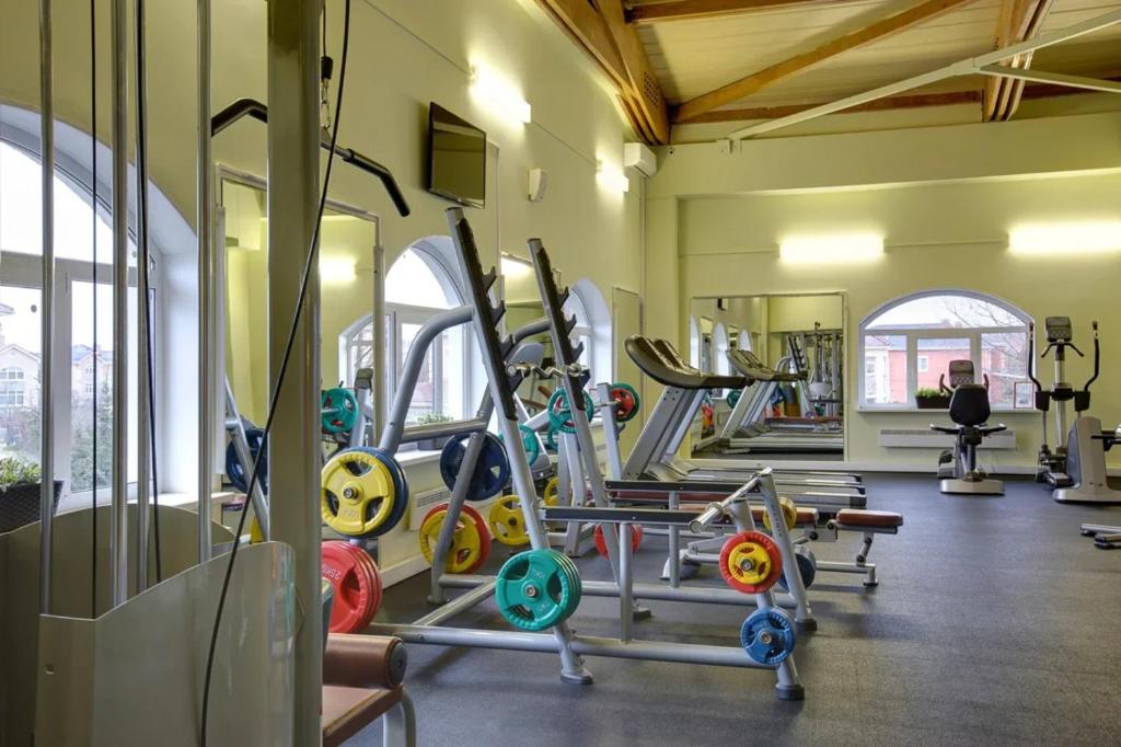 a gym with a bunch of tread machines in it at Grand Peterhof Spa Hotel in Petergof