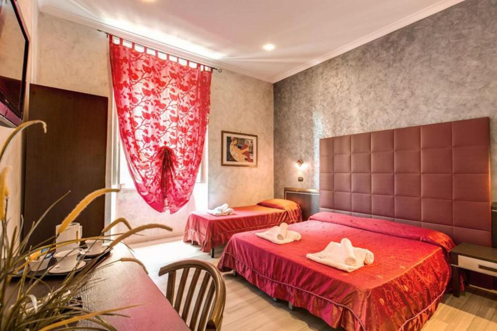 Posteľ alebo postele v izbe v ubytovaní New Inn