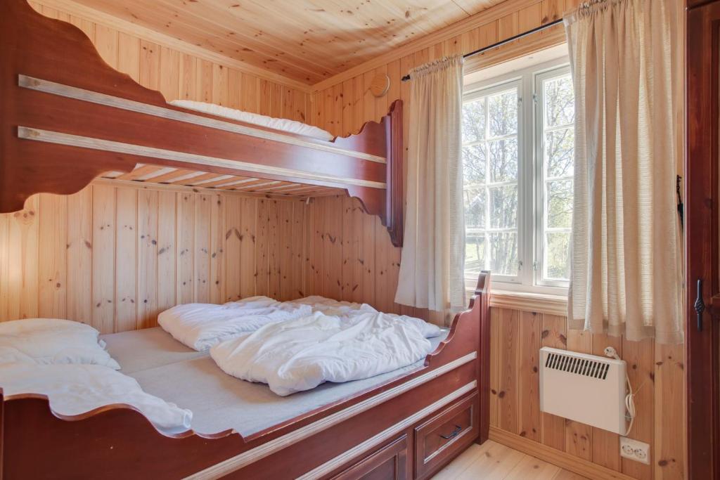 Postel nebo postele na pokoji v ubytování Mugnablikk