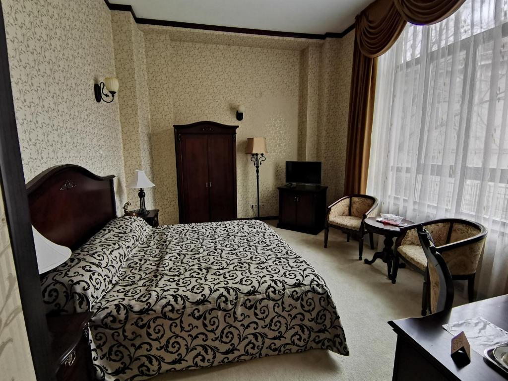 Кровать или кровати в номере Hotel Carol