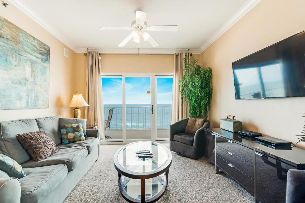 a living room with a couch and a table at Seawind #1109 in Gulf Shores