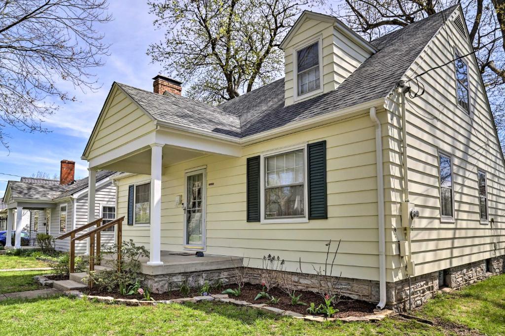 a yellow house with a window and a roof at Lexington Getaway with Backyard Deck Less Than 2 Mi to UK! in Lexington